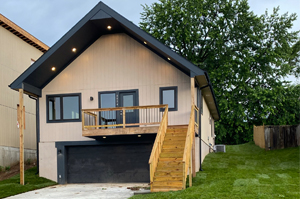 Modern new-construction home built by EE DevCo at dusk