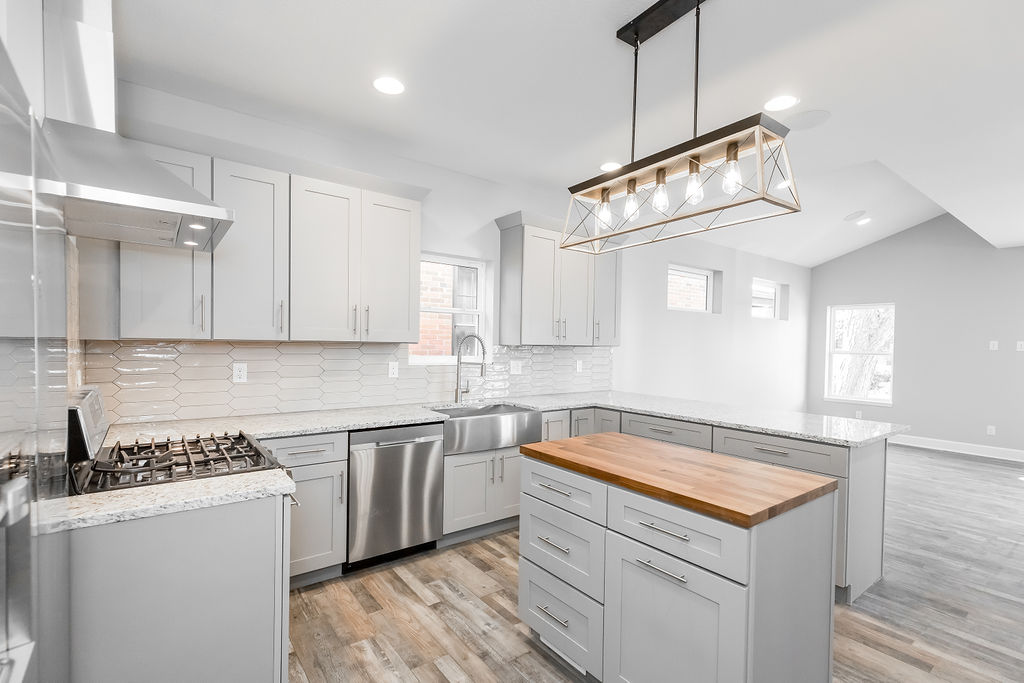 Detail of finished kitchen cabinetry and tile in a Longfellow home